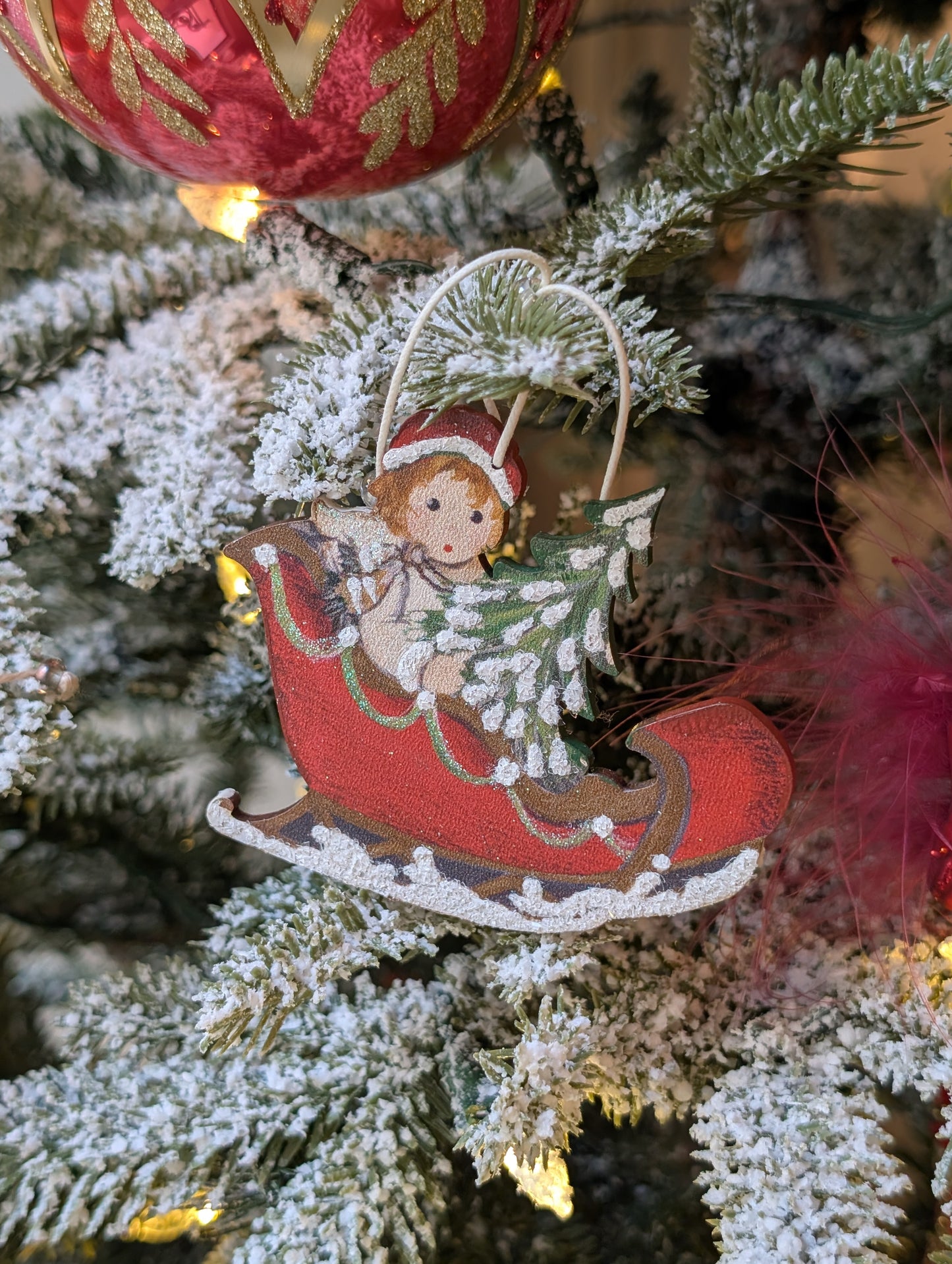 Ange dans le traîneau 🇩🇪