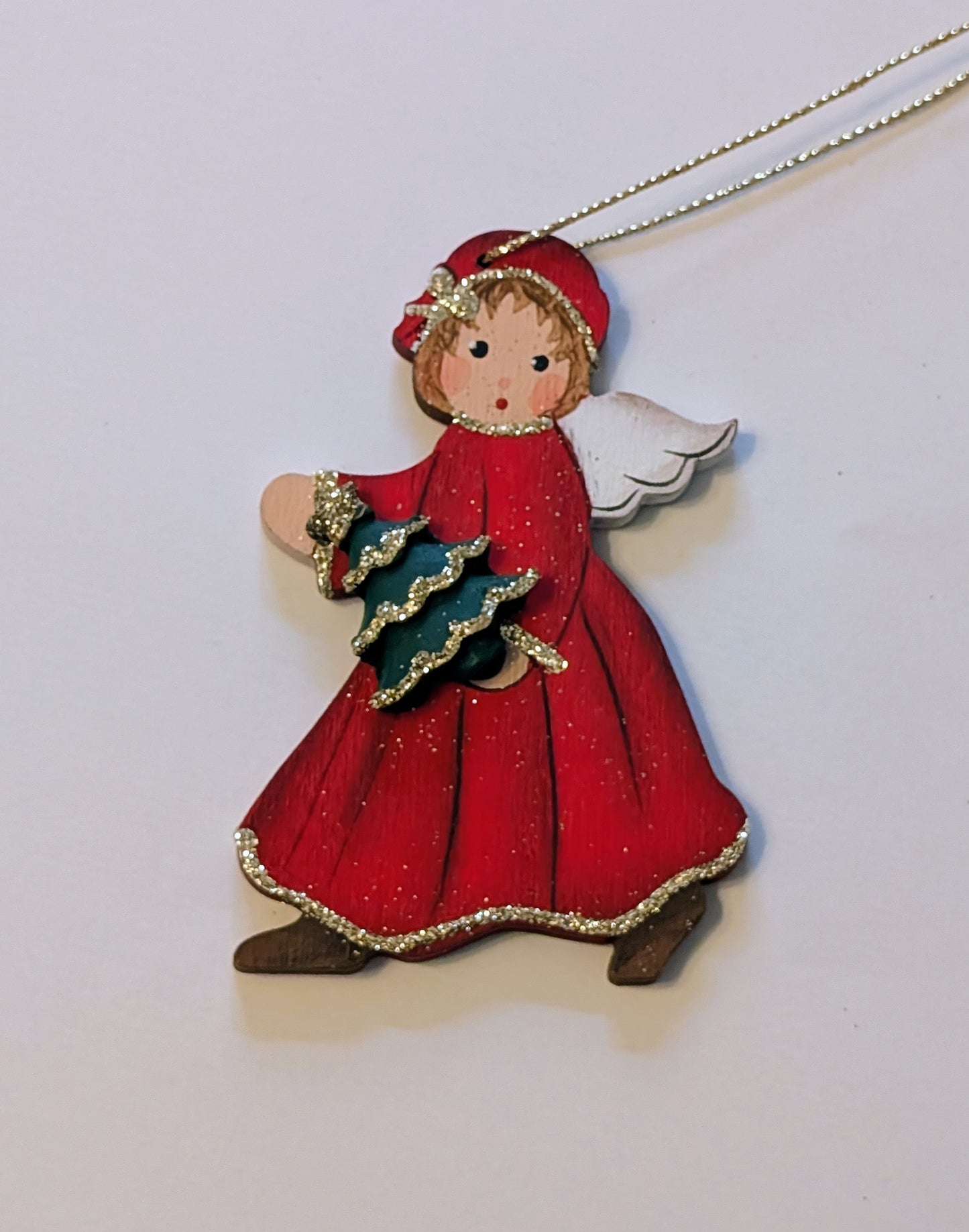 Ange en manteau rouge 🇩🇪